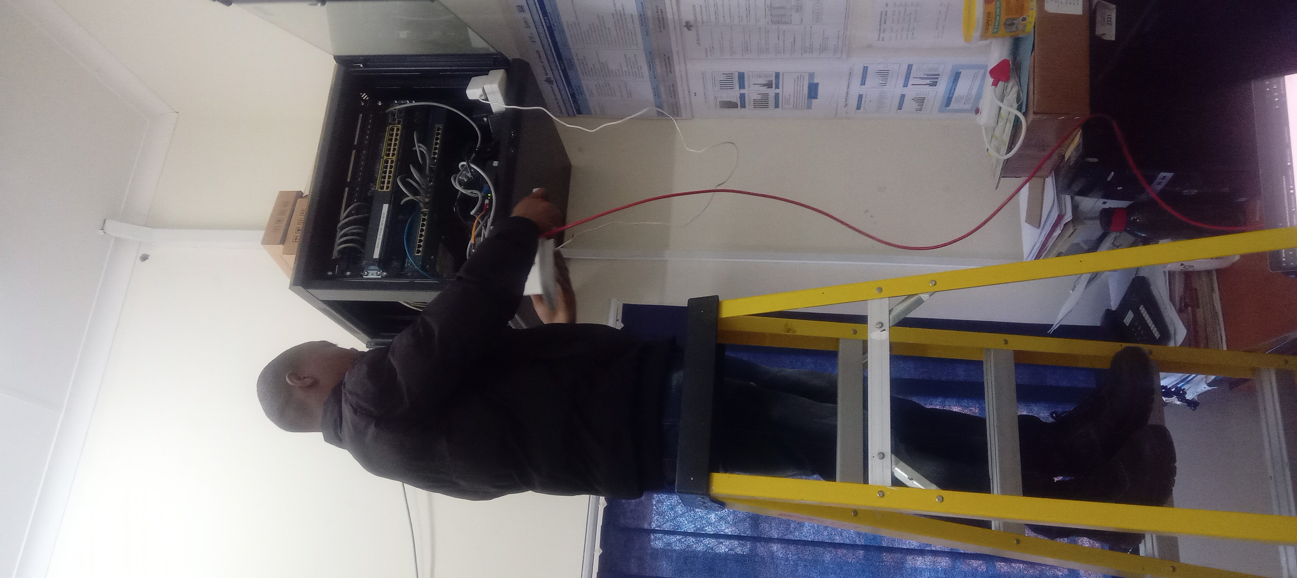 Mabona installing network equipment at HMIS Unit